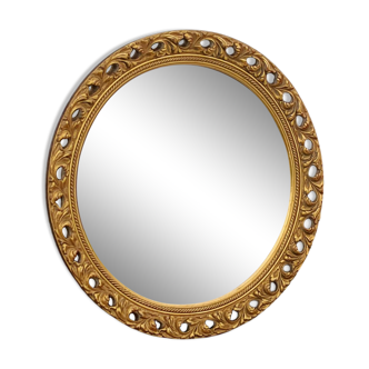 Round neoclassical style mirror in wood and gilded stucco from the 1950s