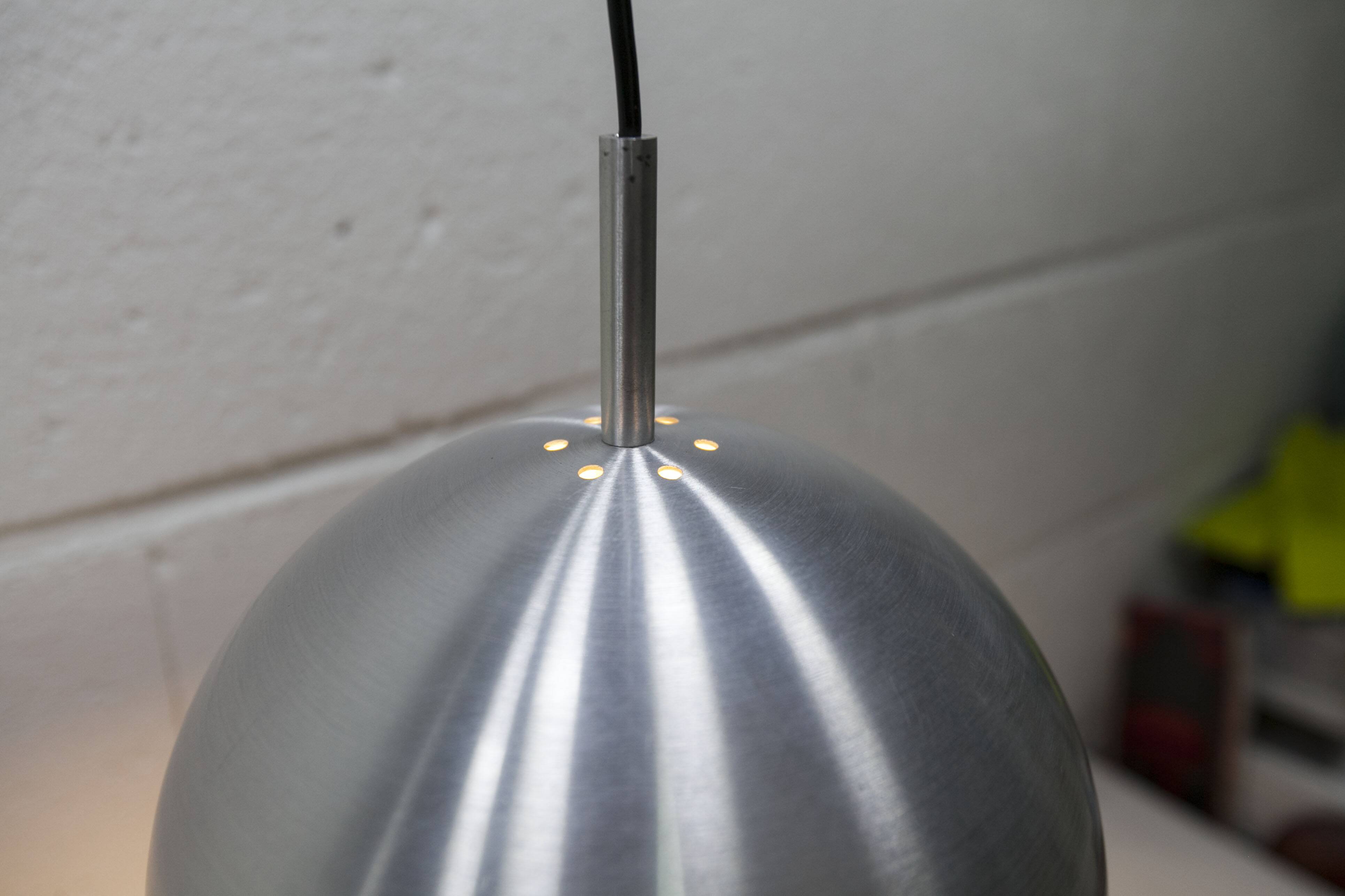 Pair of functional 70's aluminum ball pendants