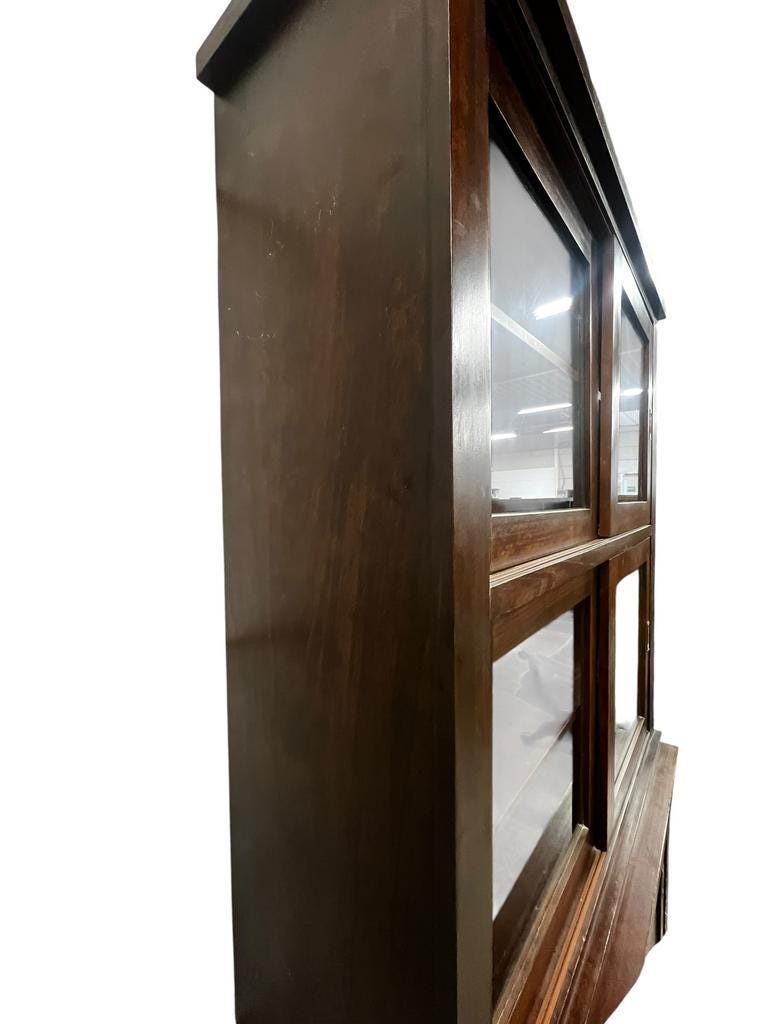 Vintage wooden display cabinet with sliding doors.