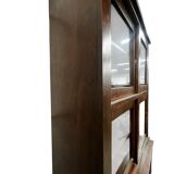 Vintage wooden display cabinet with sliding doors.