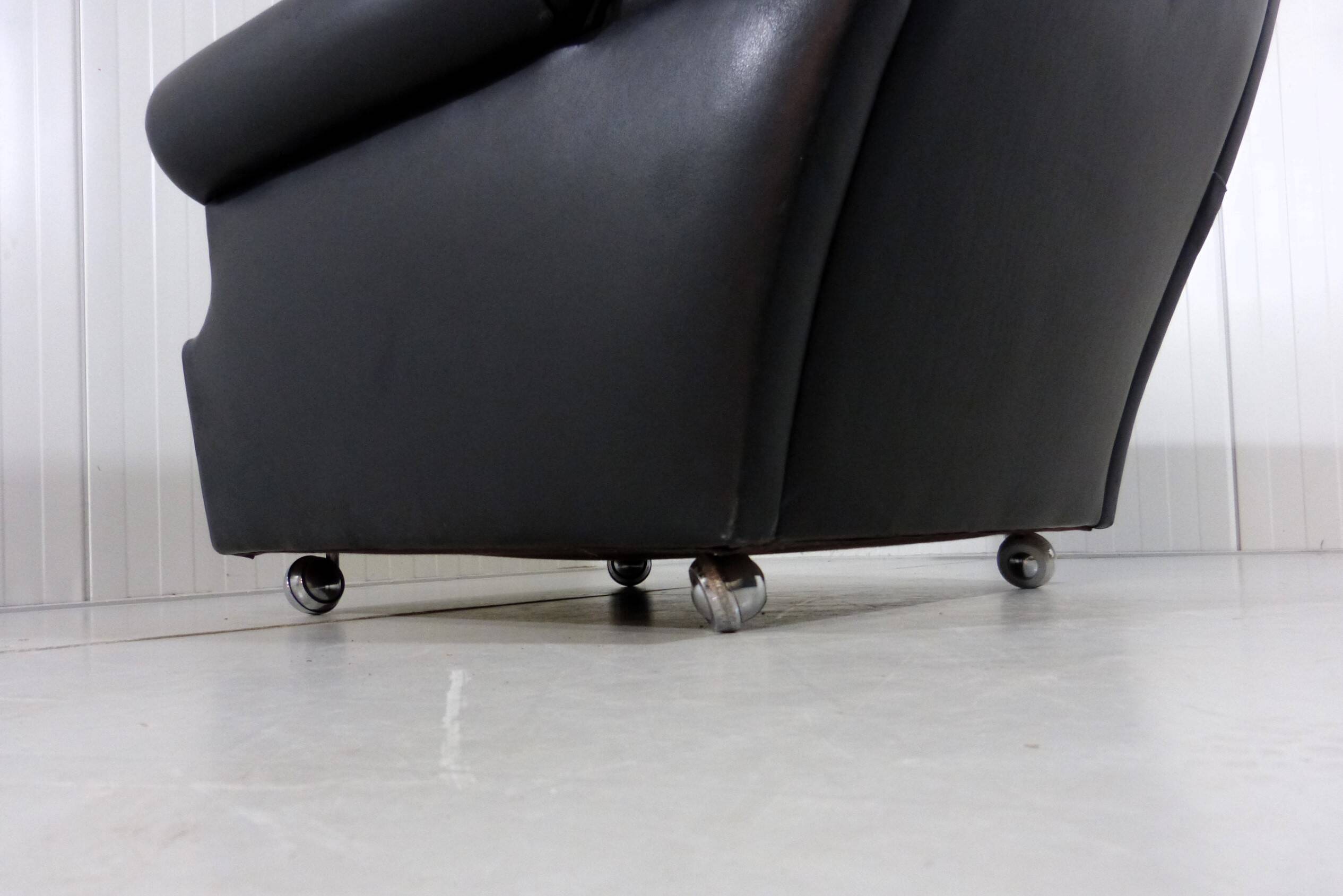 Black leather wingback chair on wheels 1960’s