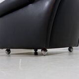 Black leather wingback chair on wheels 1960’s