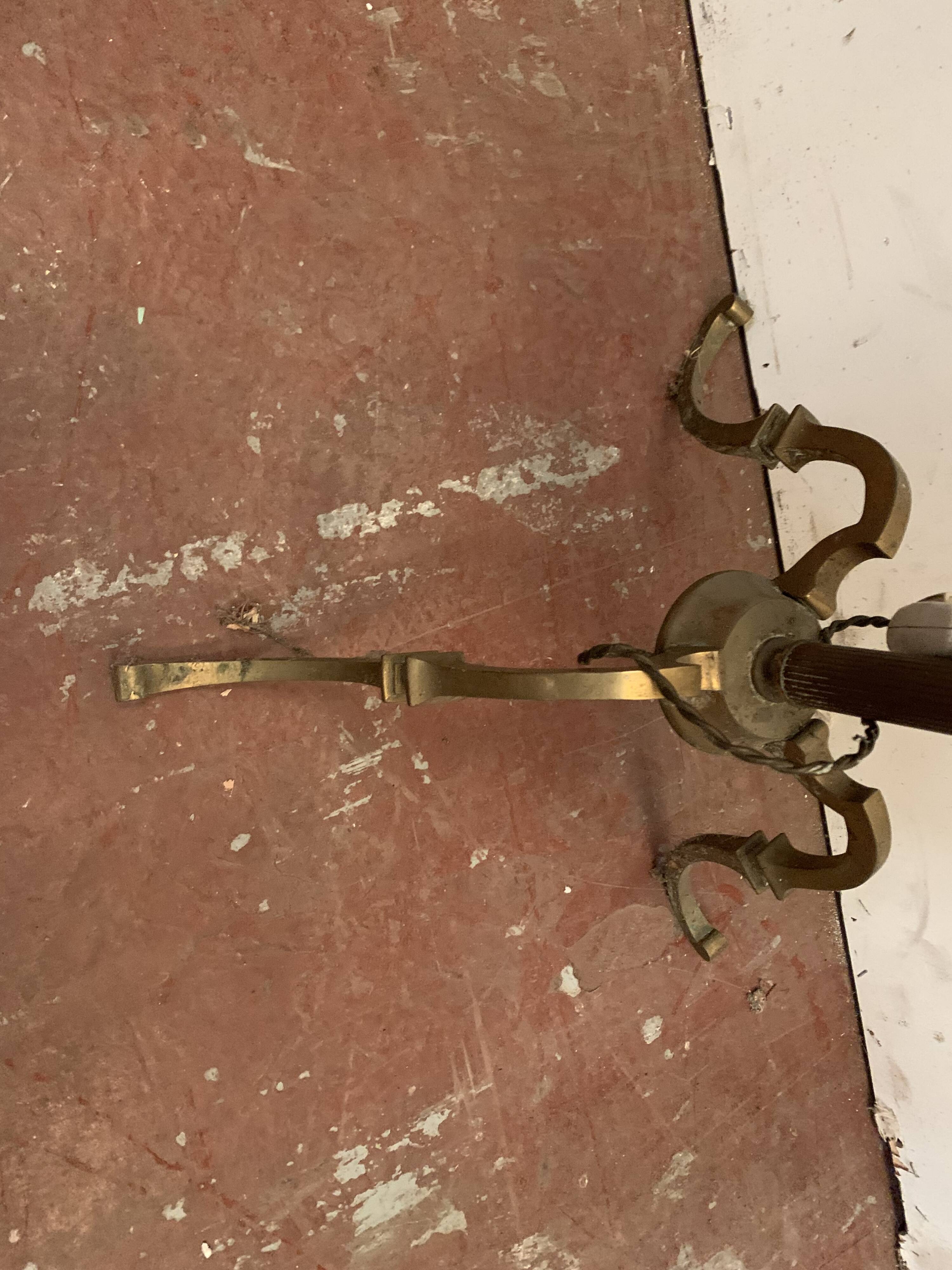 Floor lamp has three brass light arms