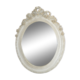 white patinated oval mirror with a bow and roses  88x115cm