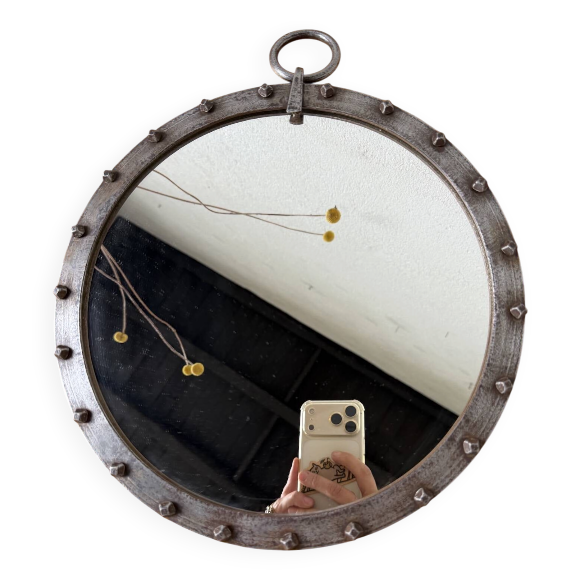 Brutalist round mirror with wrought iron and studs.