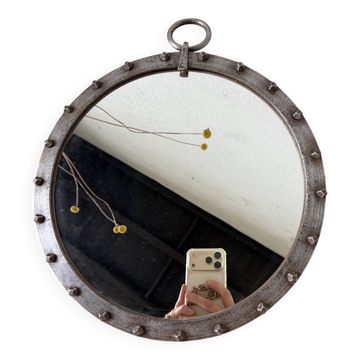 Brutalist round mirror with wrought iron and studs.