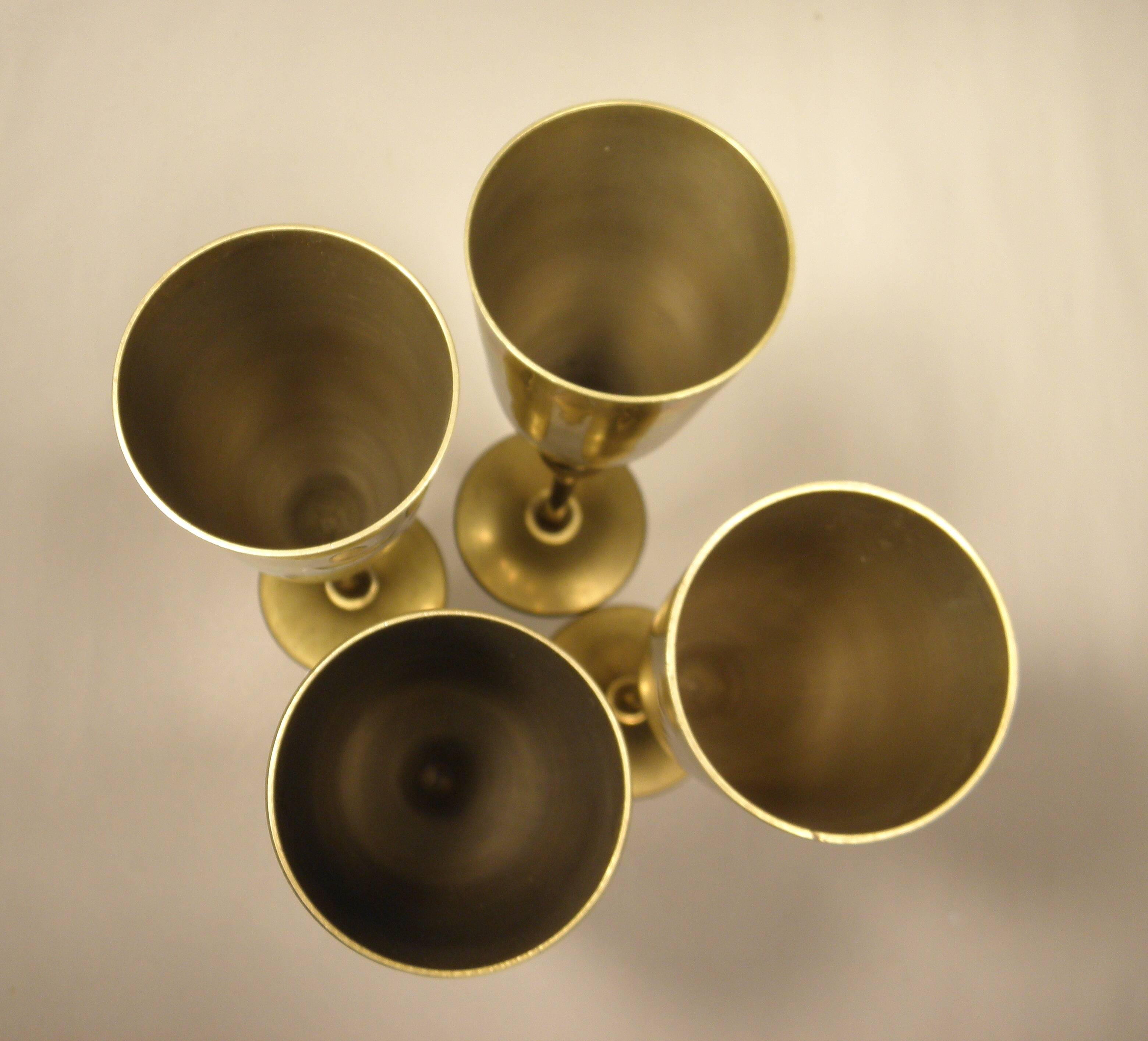 4 flutes, brass champagne glasses