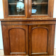 English showcase in two mahogany bodies and 19th century veneer