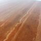 Large round red travertine dining table, 1970s