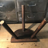 Wooden milking stool on tripod base