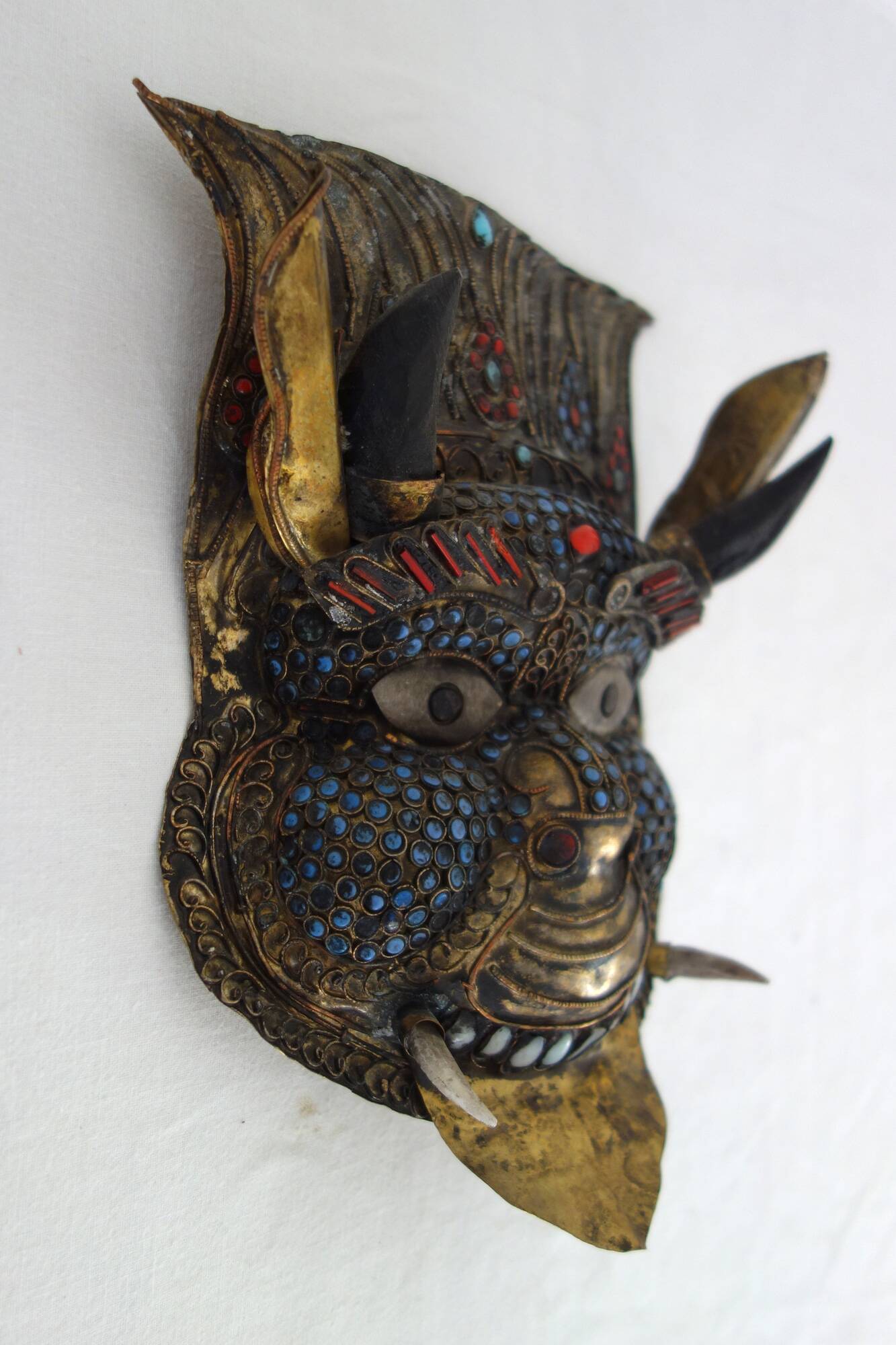 Vintage ritual mask in repoussé brass from Nepal/Tibet.