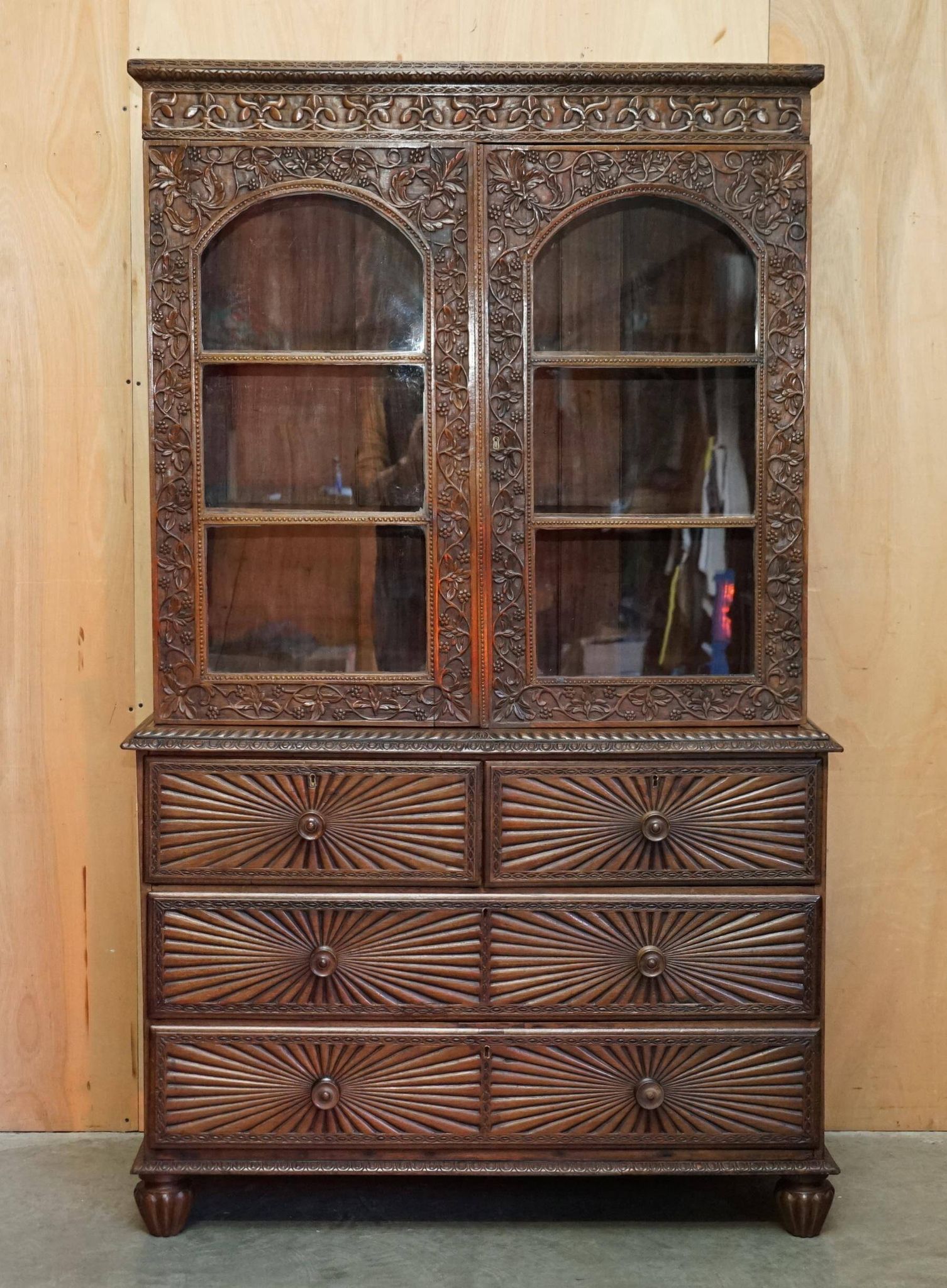 19th-century Anglo-Indian colonial hardwood library on a chest of drawers.