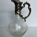 Glass decanter and silver metal frame