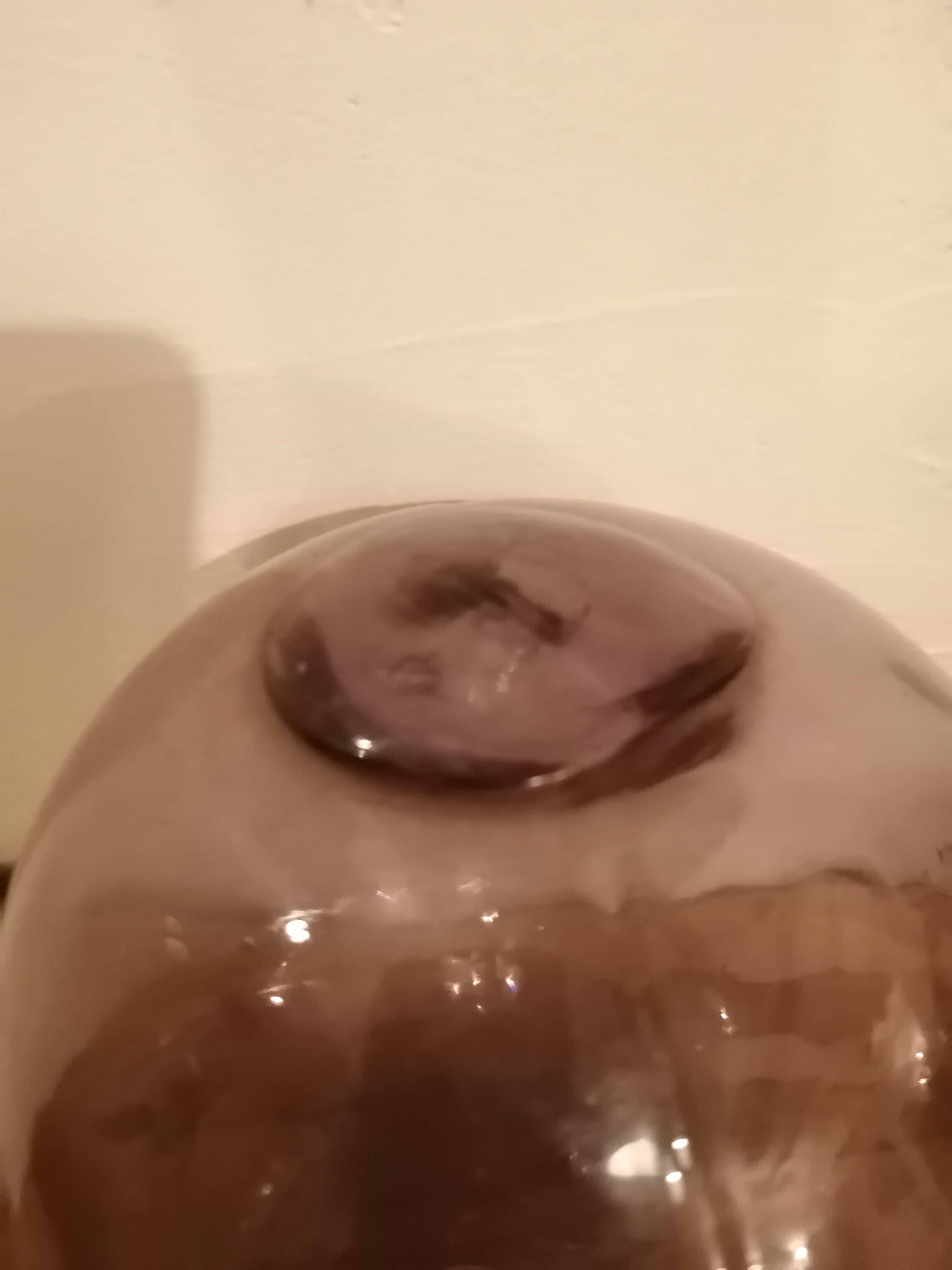 Old glass ball of fishing net marked "LT"