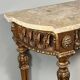 Louis XVI style console in carved wood with a gilded patina, 19th century.