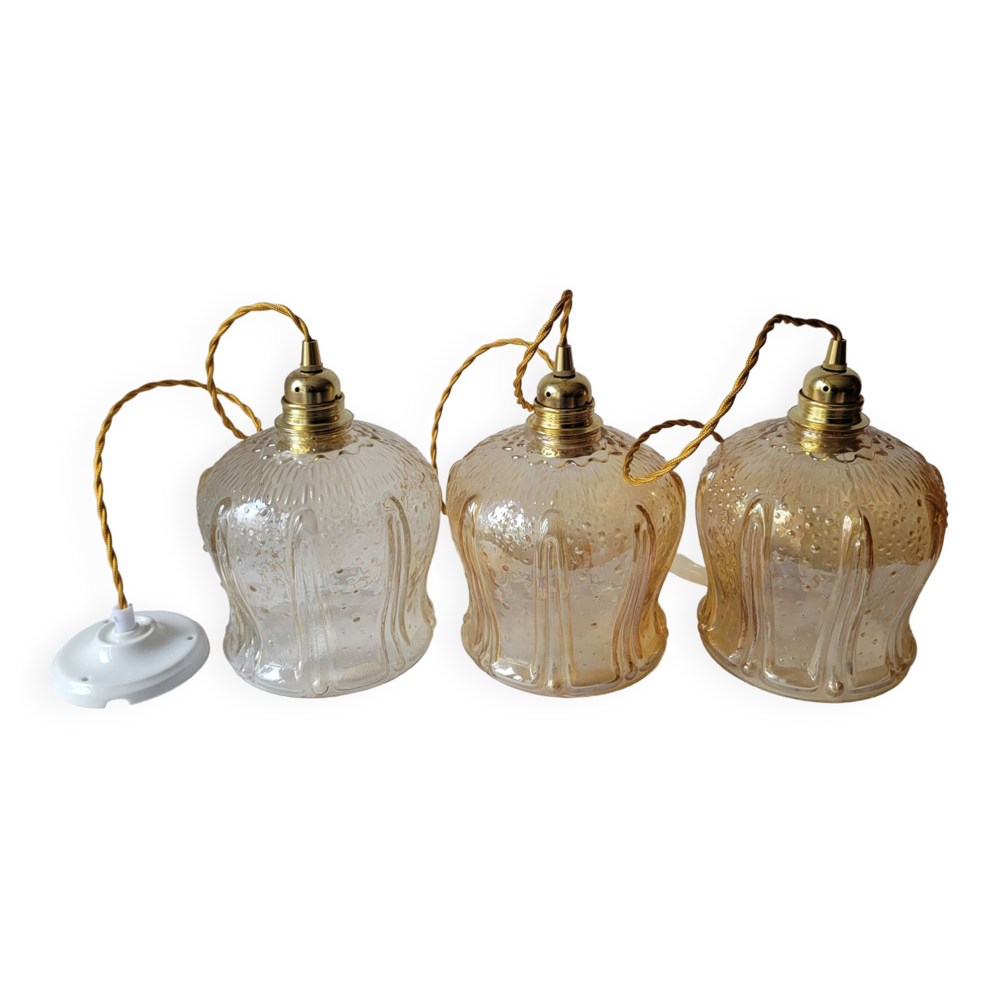 Trio of amber glass pendant lights