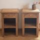 Pair of antique bedside tables / nightstands in raw solid oak.