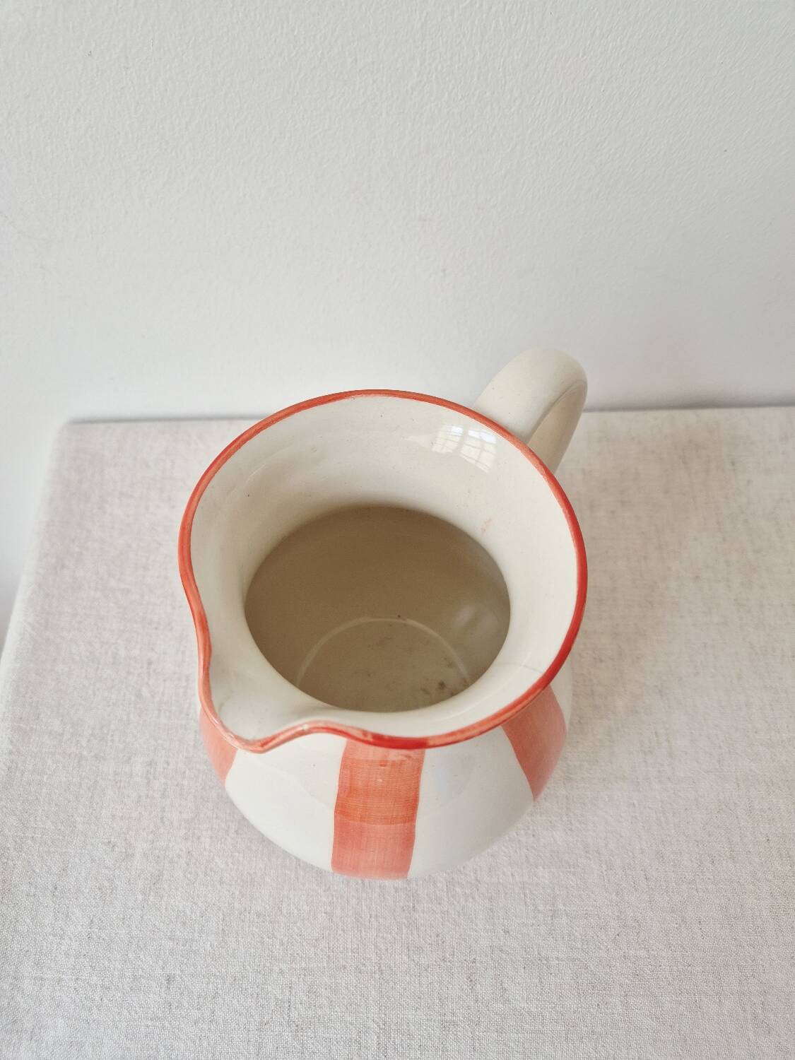 Vintage ceramic vase/pitcher with handmade mandarin stripes.