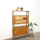 Vintage wooden showcase with sliding doors and white handles