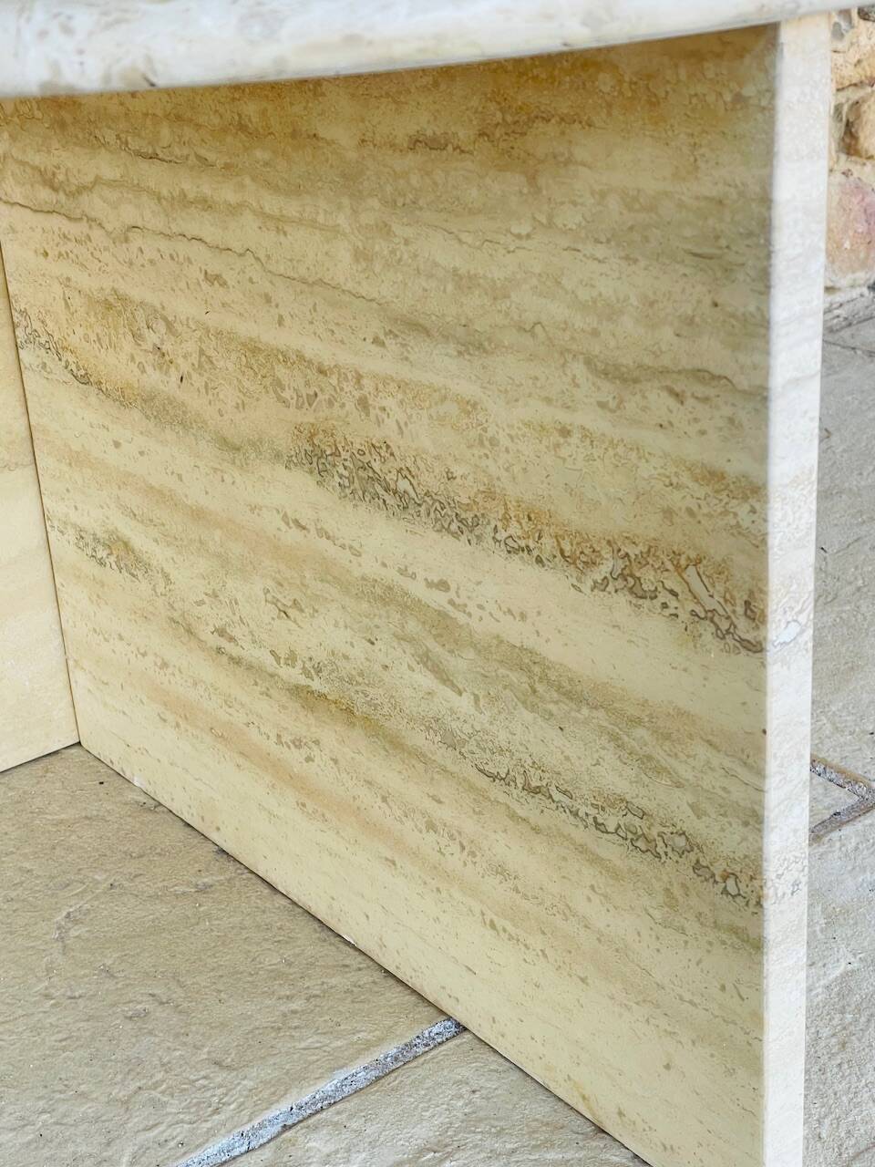 Vintage side table in travertine, circa 1980s.