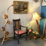 Carved wooden armchair and cannage