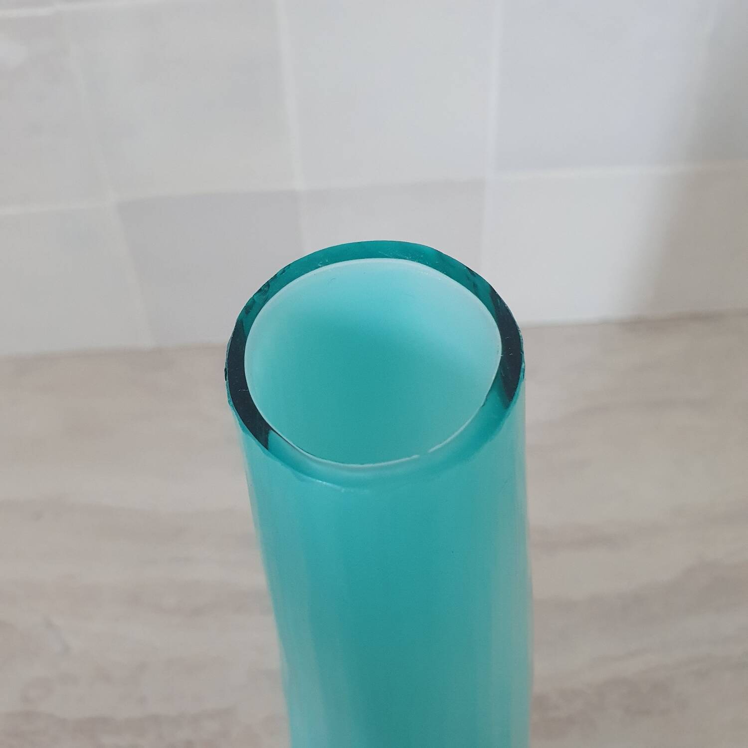 Curved turquoise blue blown glass soliflore vase