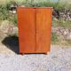 Armoire aux pieds compas