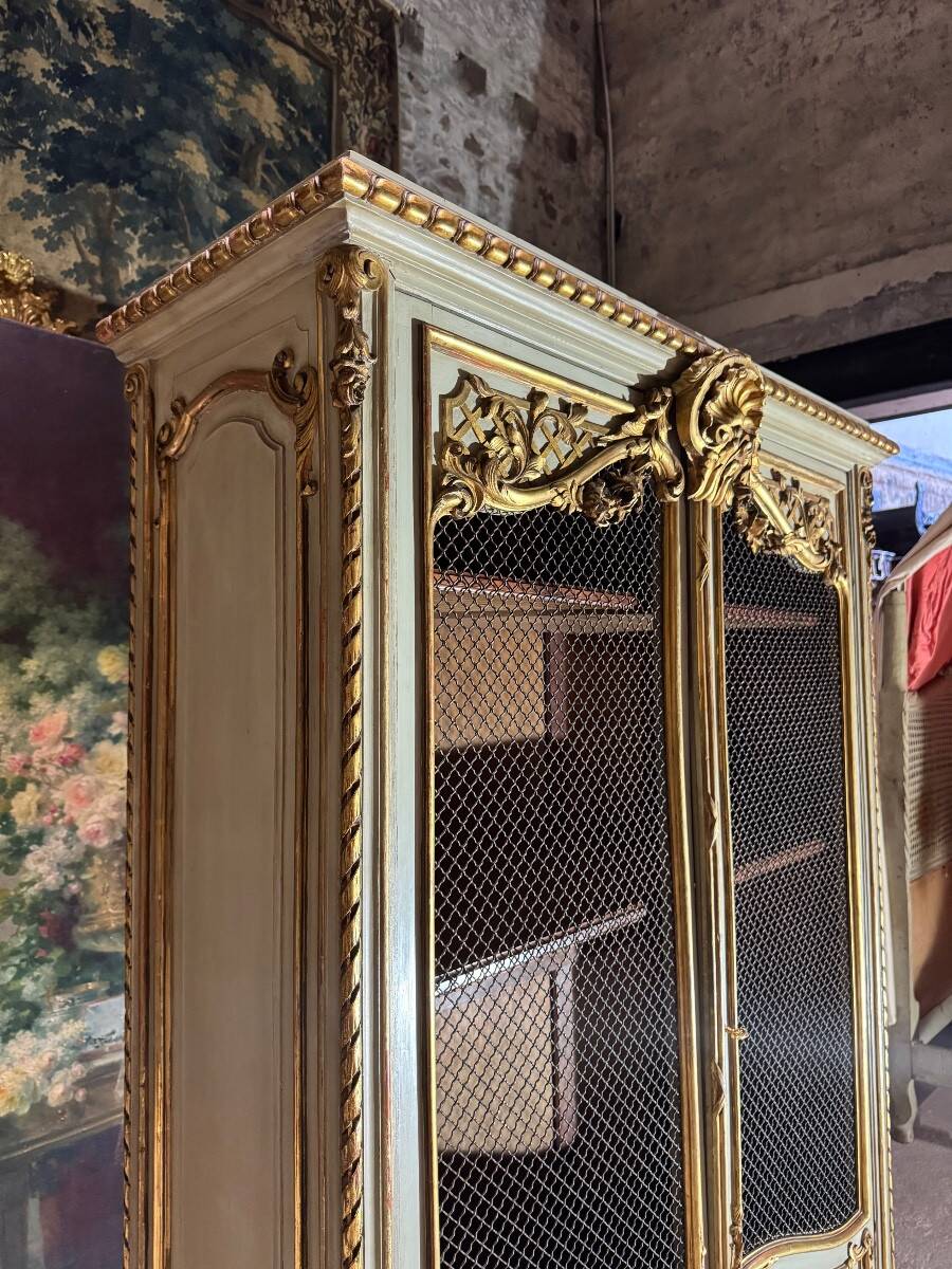 Bookcase in gilded wood and restored wood from the Napoleonic III period.