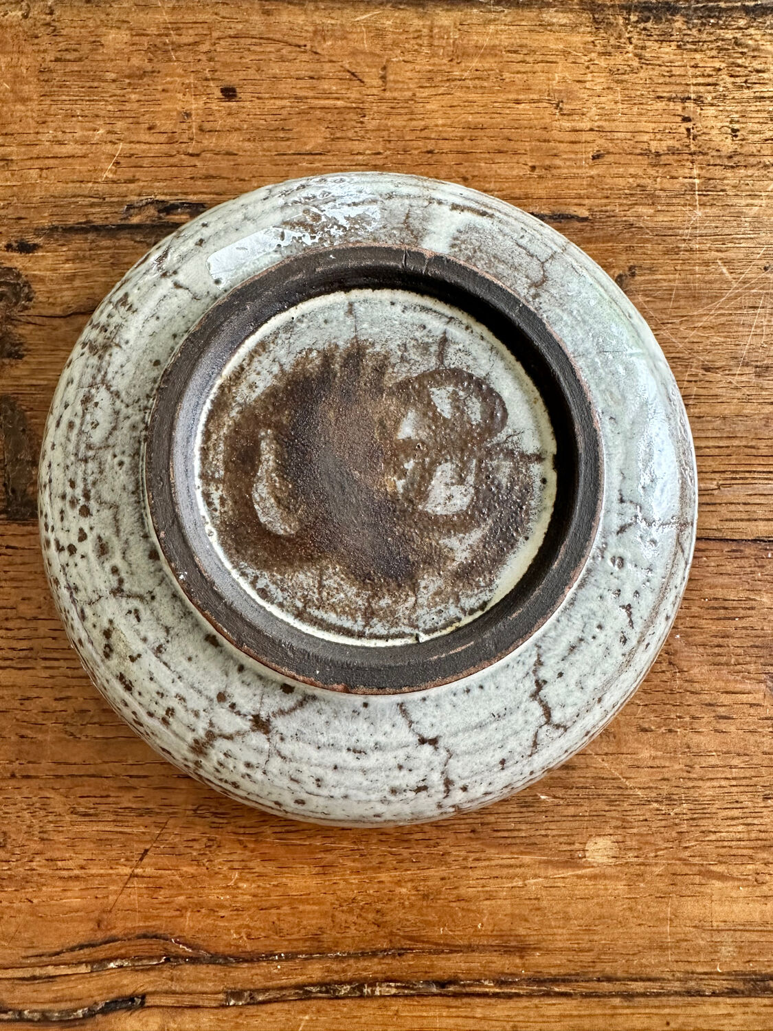 Enamelled red earth cup decorated with flowers. Gustave Reynaud.