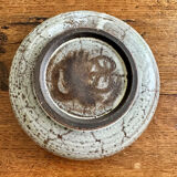 Enamelled red earth cup decorated with flowers. Gustave Reynaud.