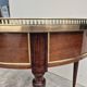 Louis XVI style mahogany bouillotte table in marquetry and bronze