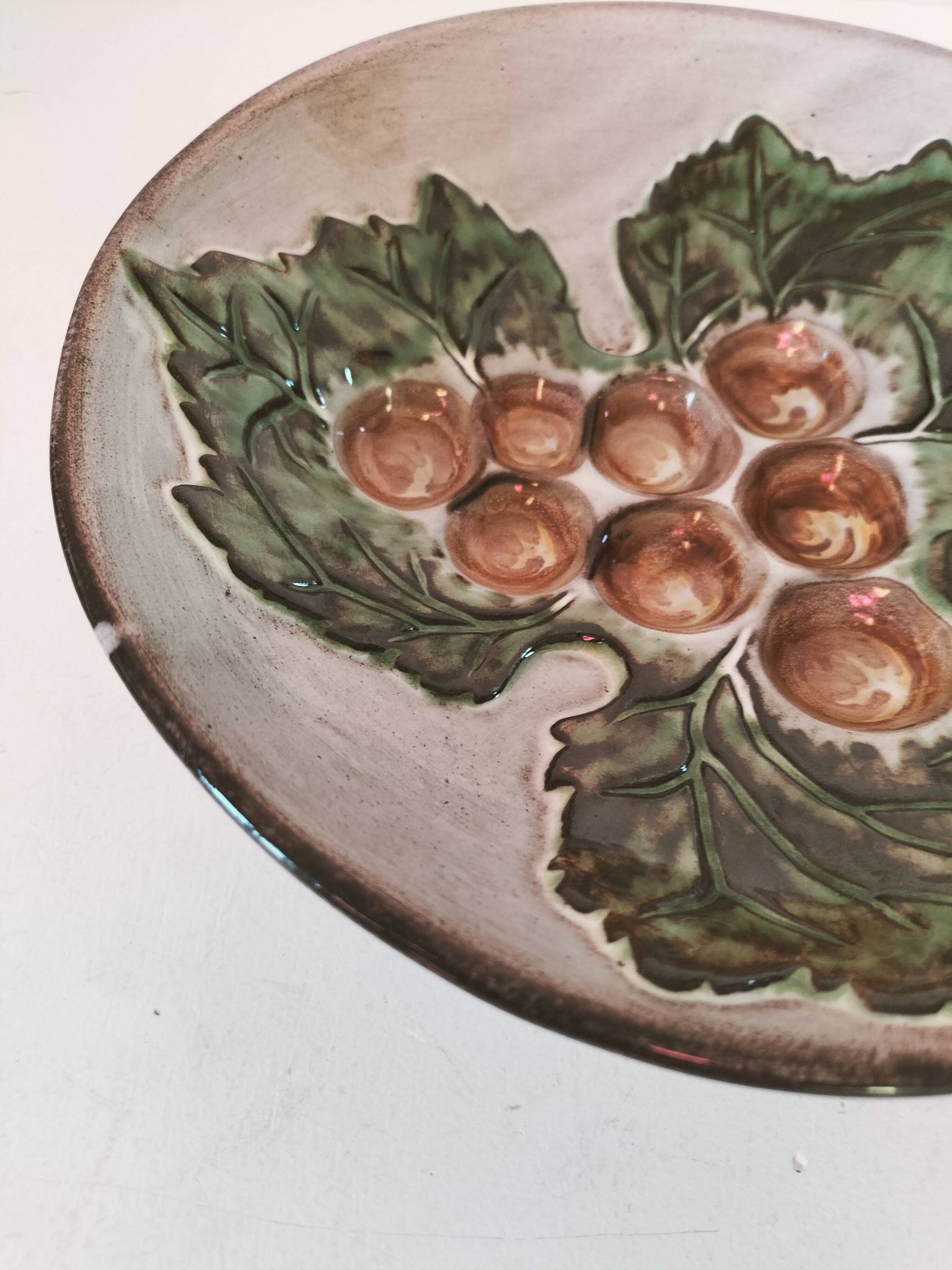 Vintage ceramic bowl – embossed grape pattern in slip style