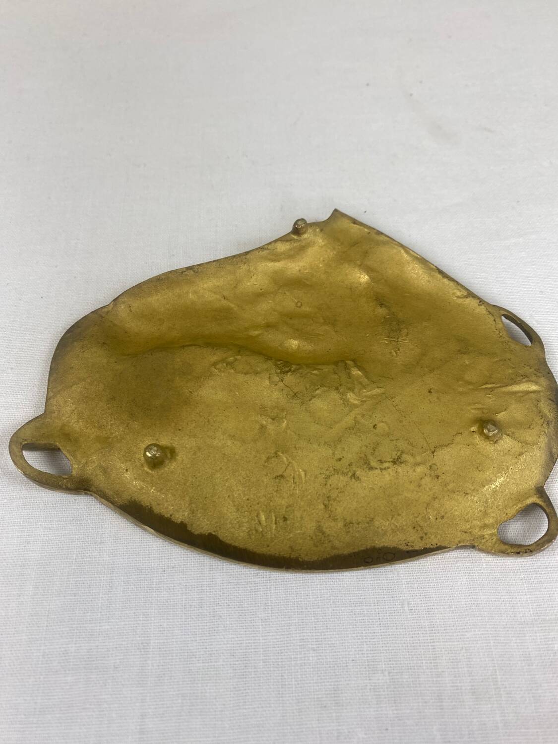 Antique brass pocket emptier