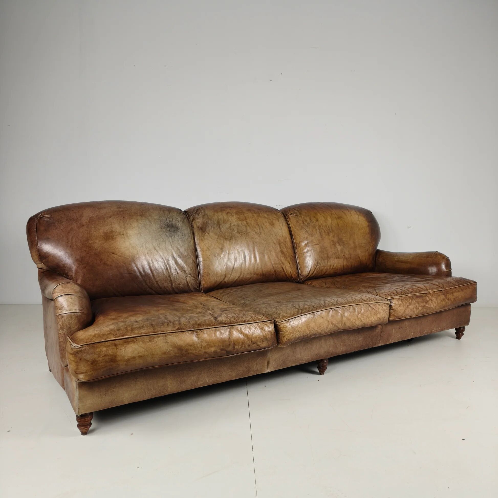 English Howard & Sons style leather sofa – 20th century