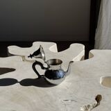 Silver-plated teapot with black handle