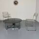 Round coffee table in smoked glass and chrome steel, 1970s design.