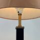 Vintage table lamp in black lacquer and gold metal, fluted column.