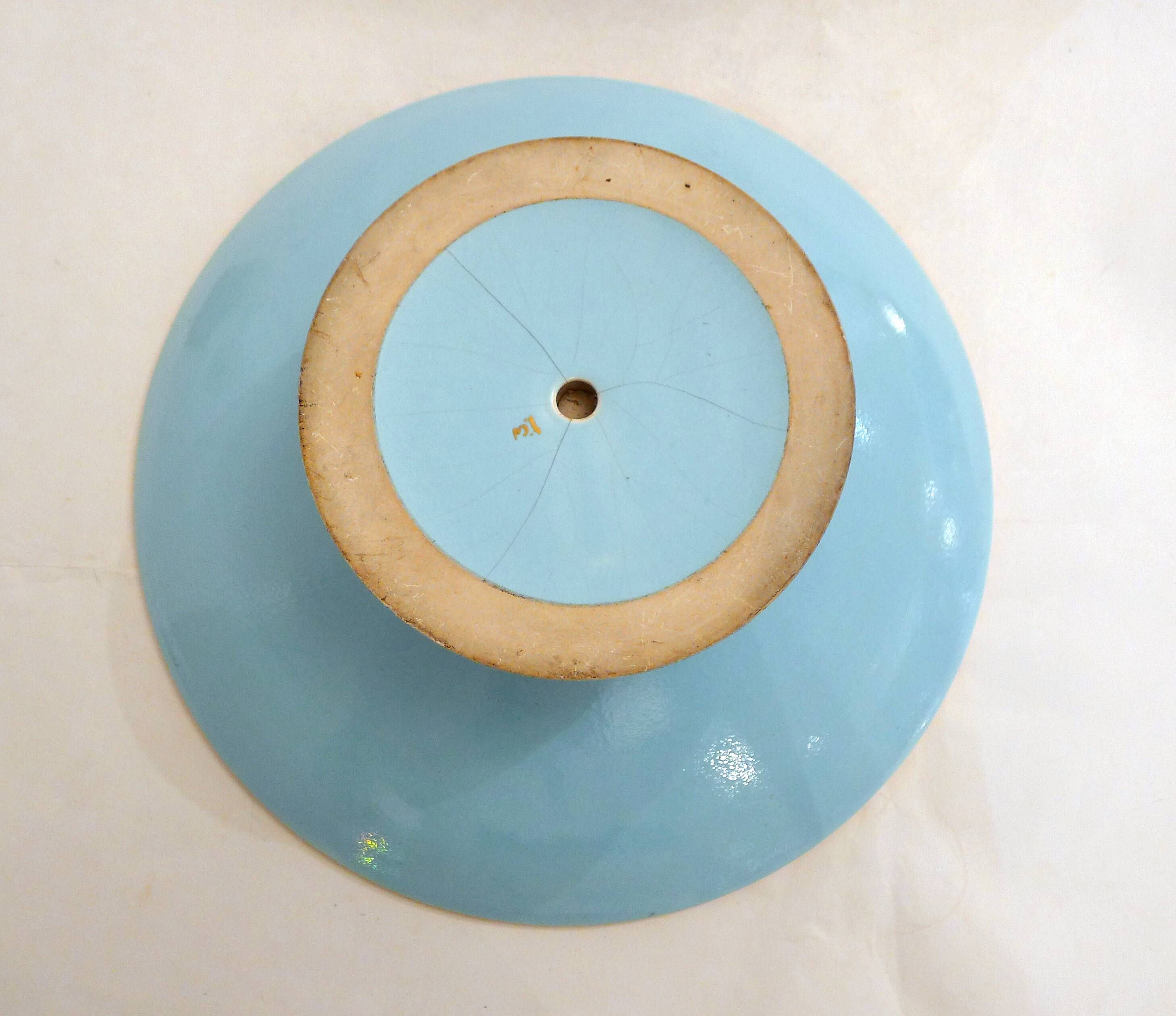 Art Deco modernist coupe, with a base of 3 spheres, in turquoise ceramic and gilding.