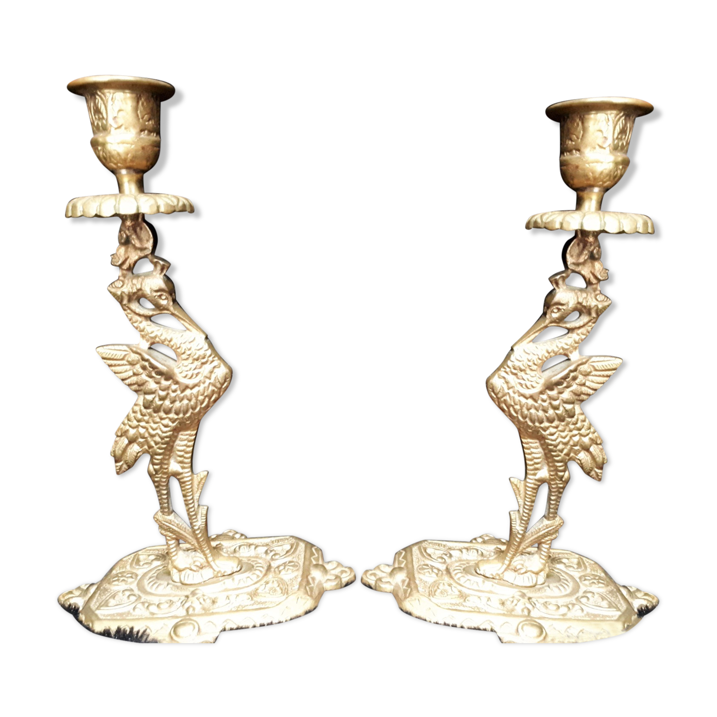 Pair of bronze candle holders decorated with herons