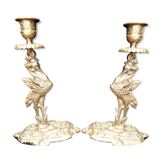 Pair of bronze candle holders decorated with herons