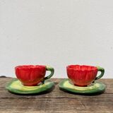 2 coffee cups red flowers and leaf in slurry shepherd