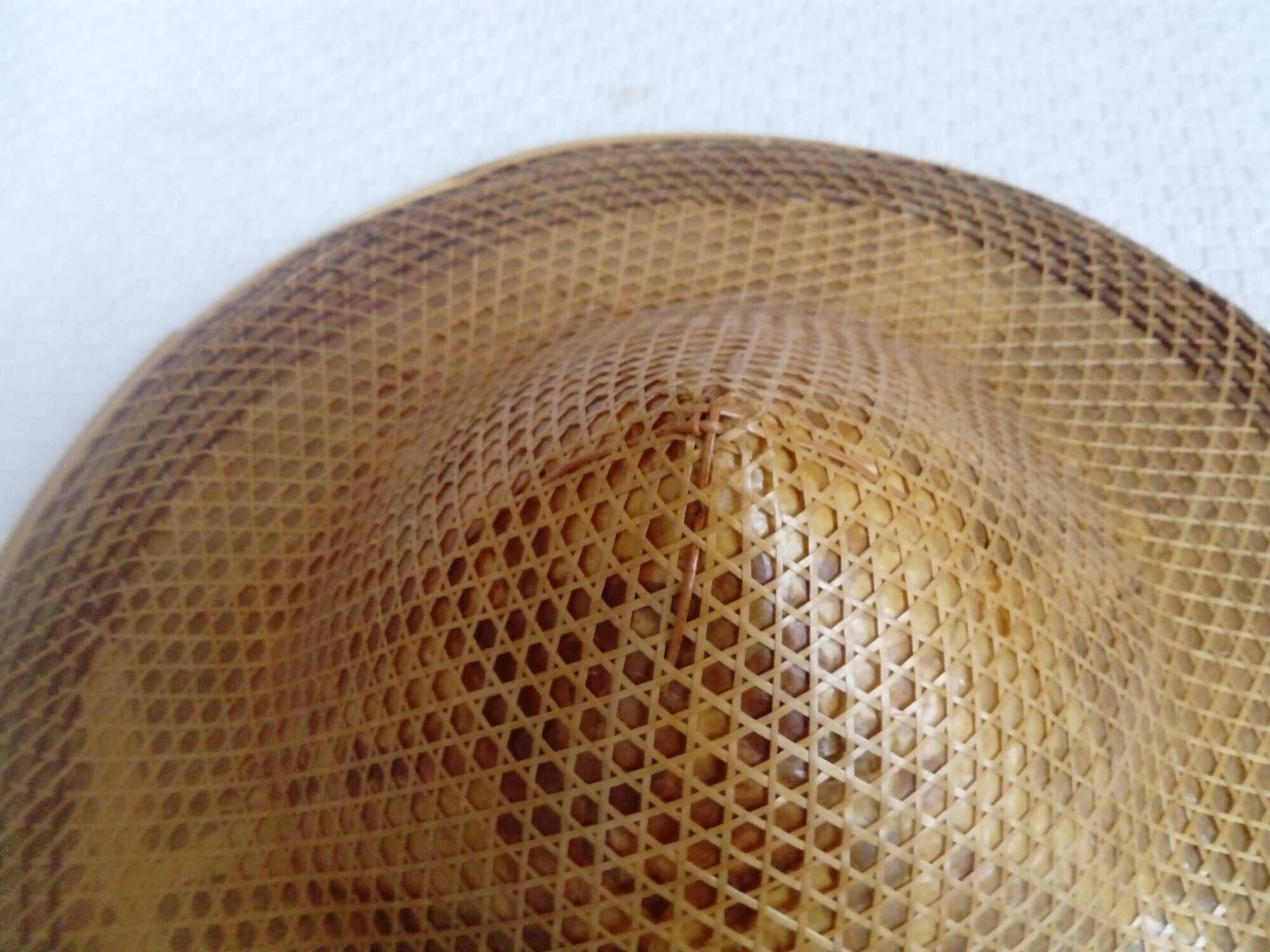braided Asian hat. palm, bamboo, straw, wicker