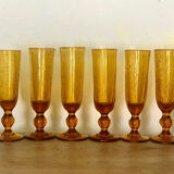 Champagne flutes bubbled amber blown