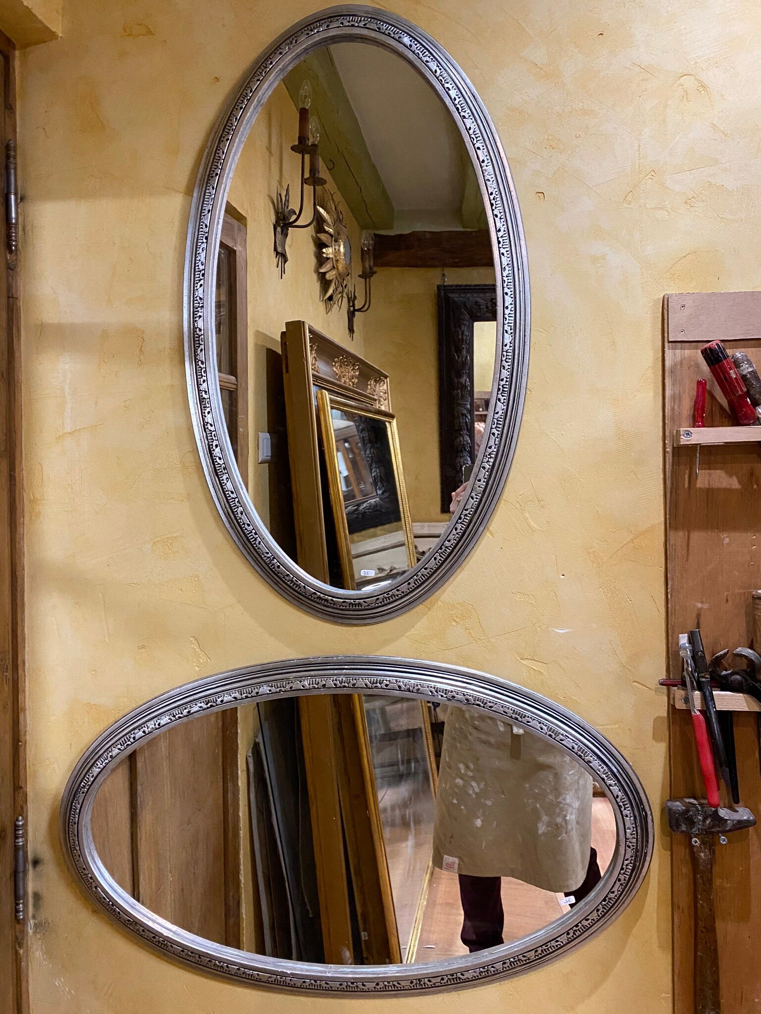 Pair of silver oval mirrors 79x46cm