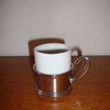 Duo of white ceramic coffee cups metal support
