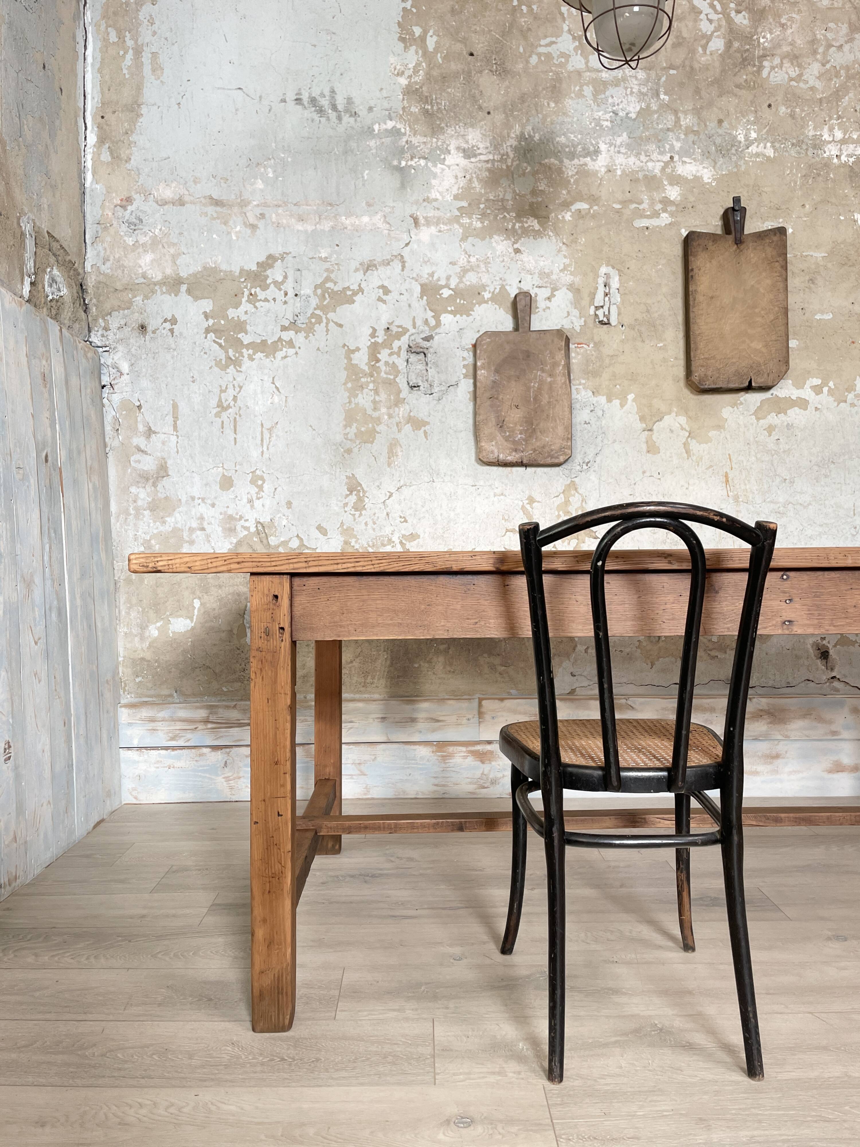 Solid wood workshop table with straight legs.