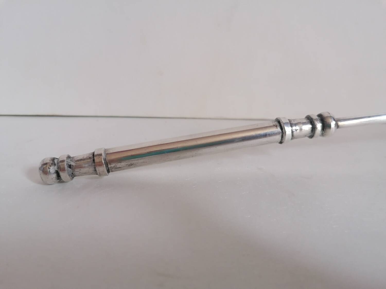 Silver metal candle snuffer