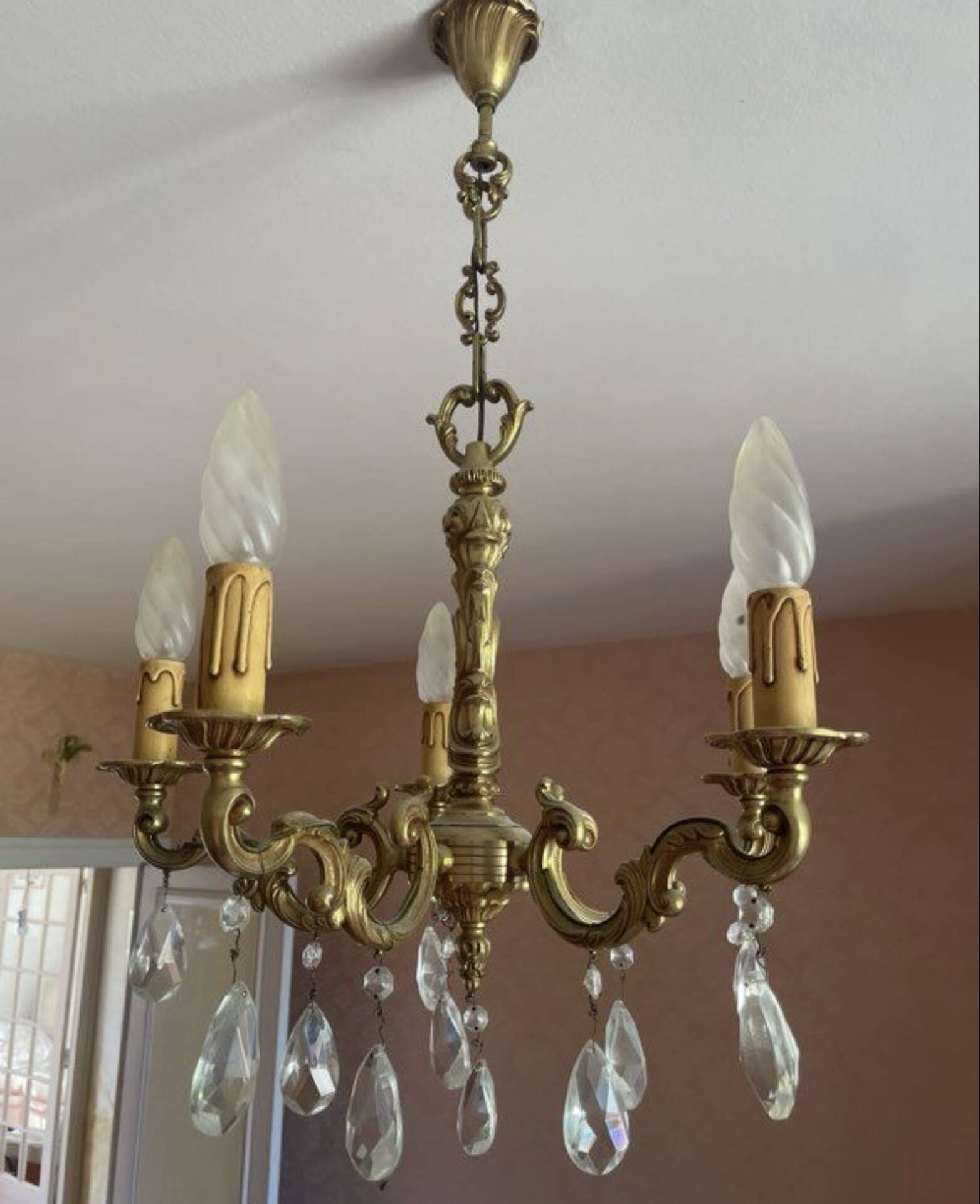 Magnificent bronze chandelier with pendants.
