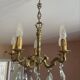Magnificent bronze chandelier with pendants.