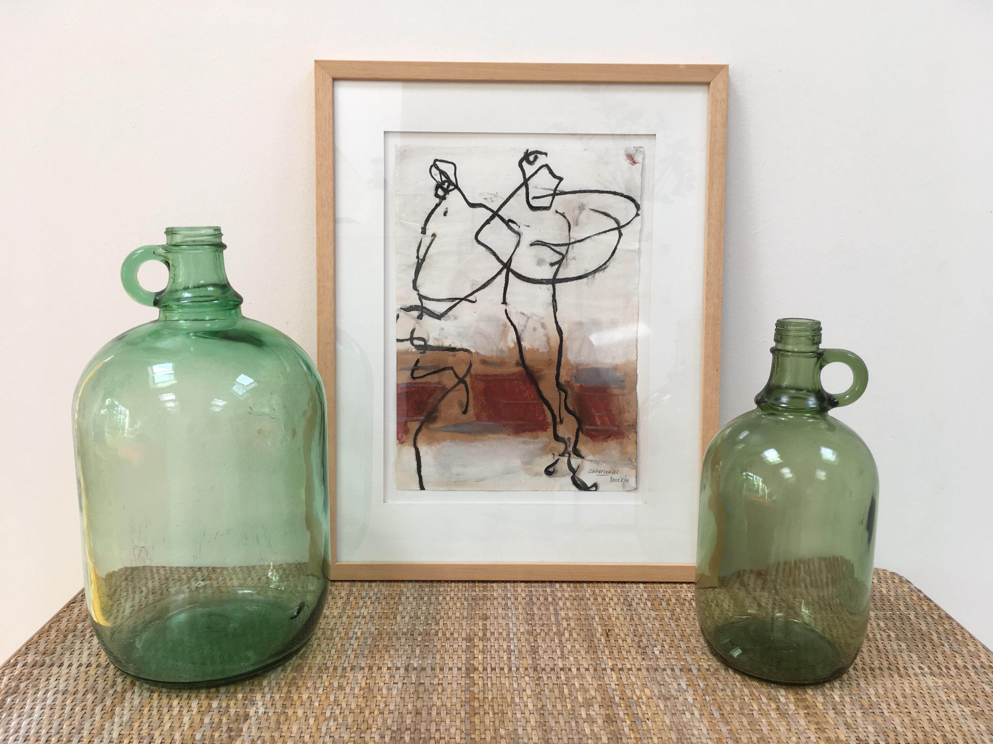 Pair of old demijohn bottles